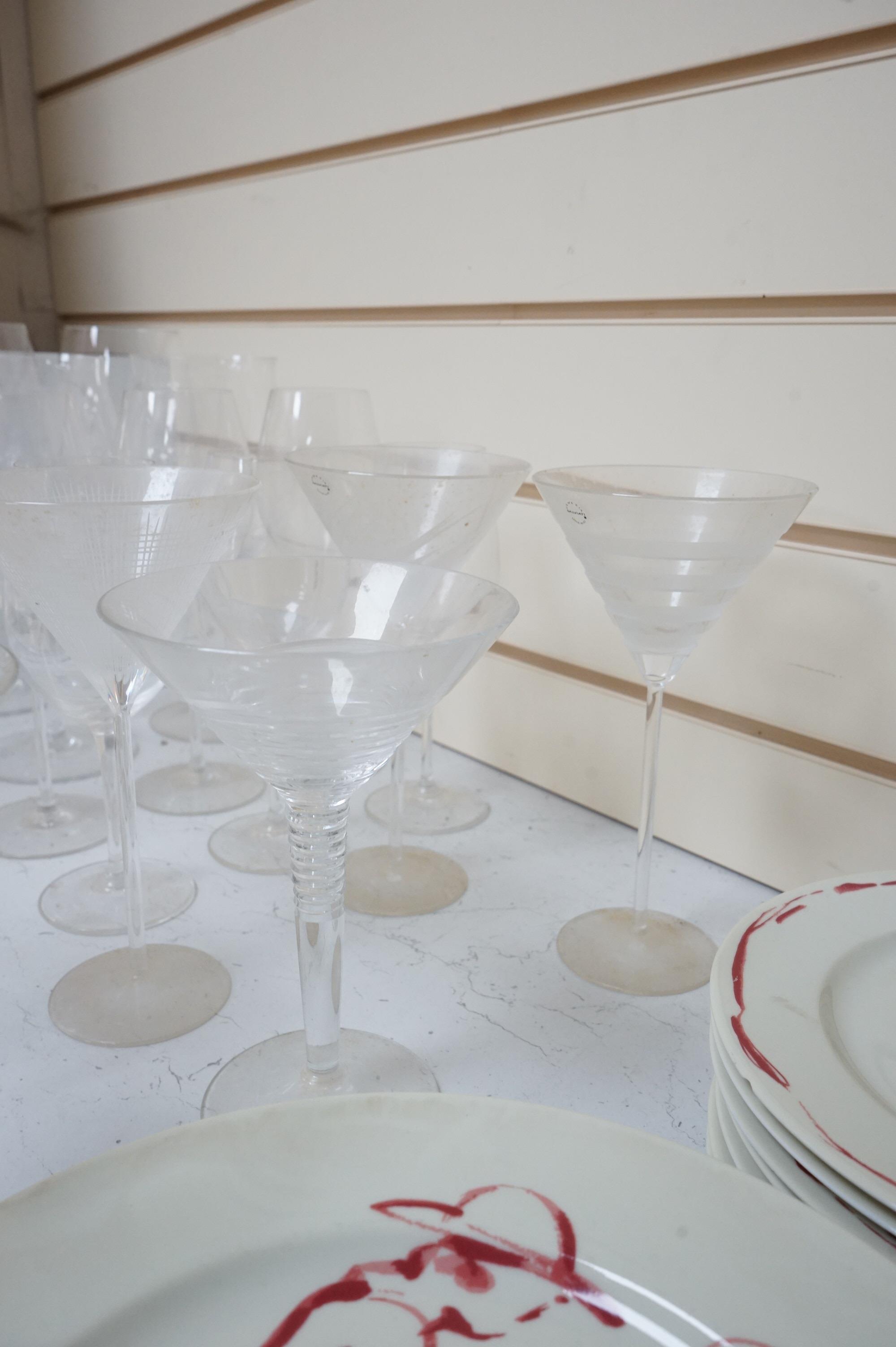 A Pierre Frey ‘Gonesse’ Limoges part dinner service, two Villeroy and Boch ‘Jardins Francais’ dinner plates, with a collection of Riedel wine glasses and mixed Salviati champagne glasses. Villeroy and Boch plates 30.5cm